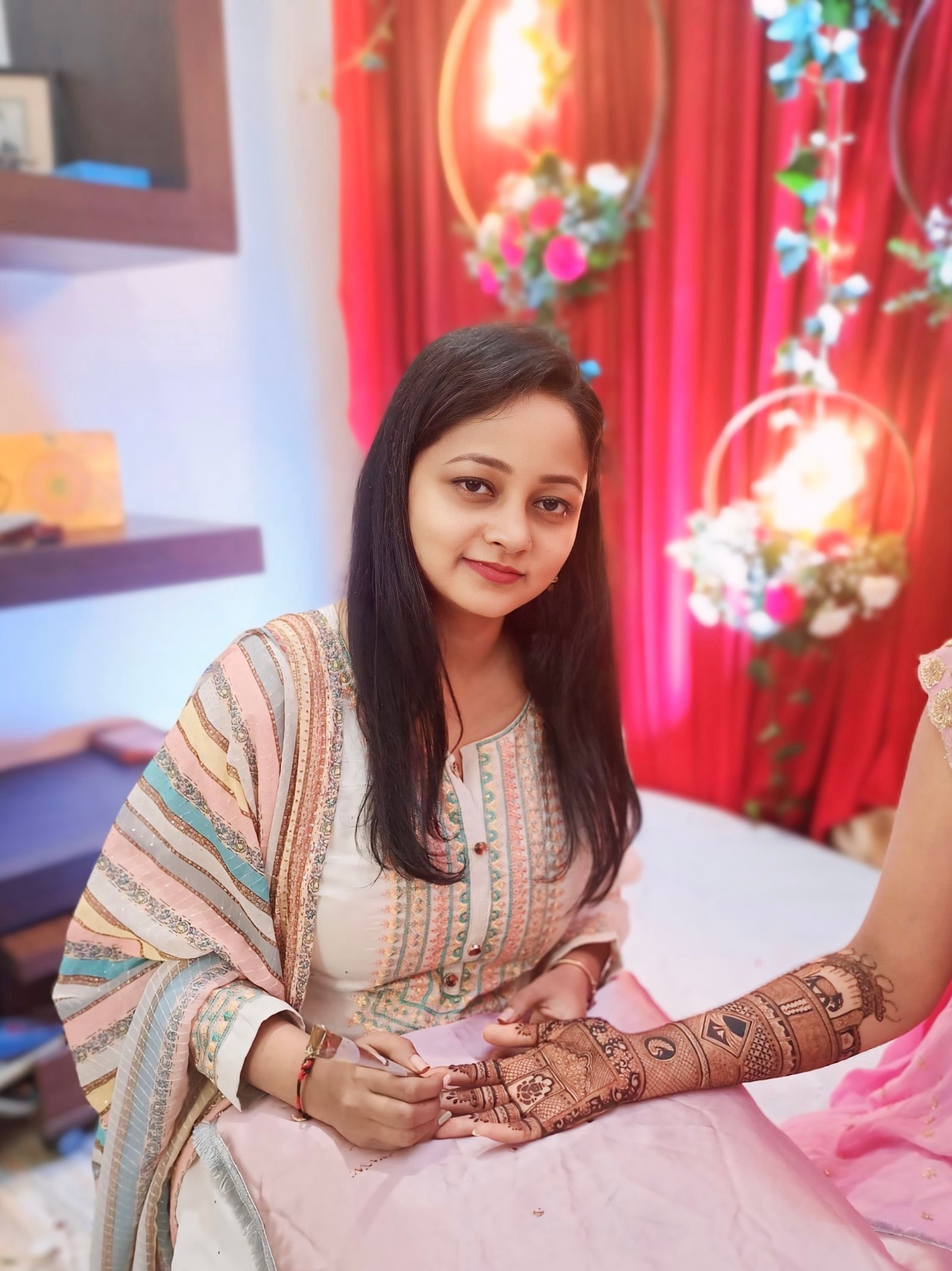 Bridal mehndi artist creating intricate henna design